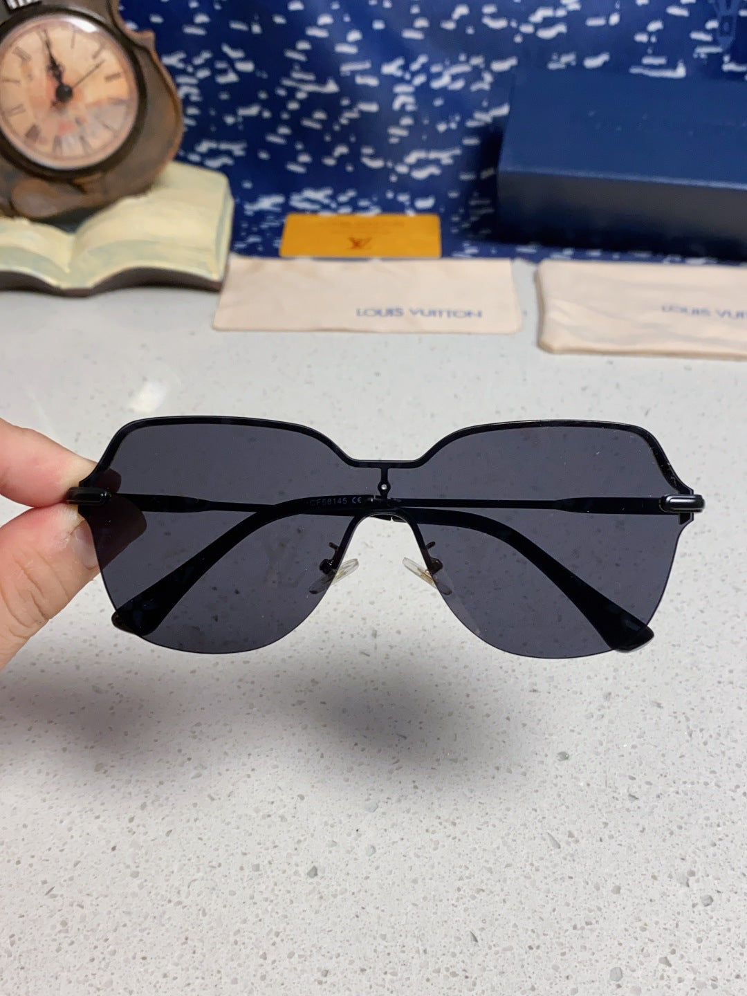 Louis Vuitton Lightweight Rimless Blue Lens Sunglasses for Women - detail image 4