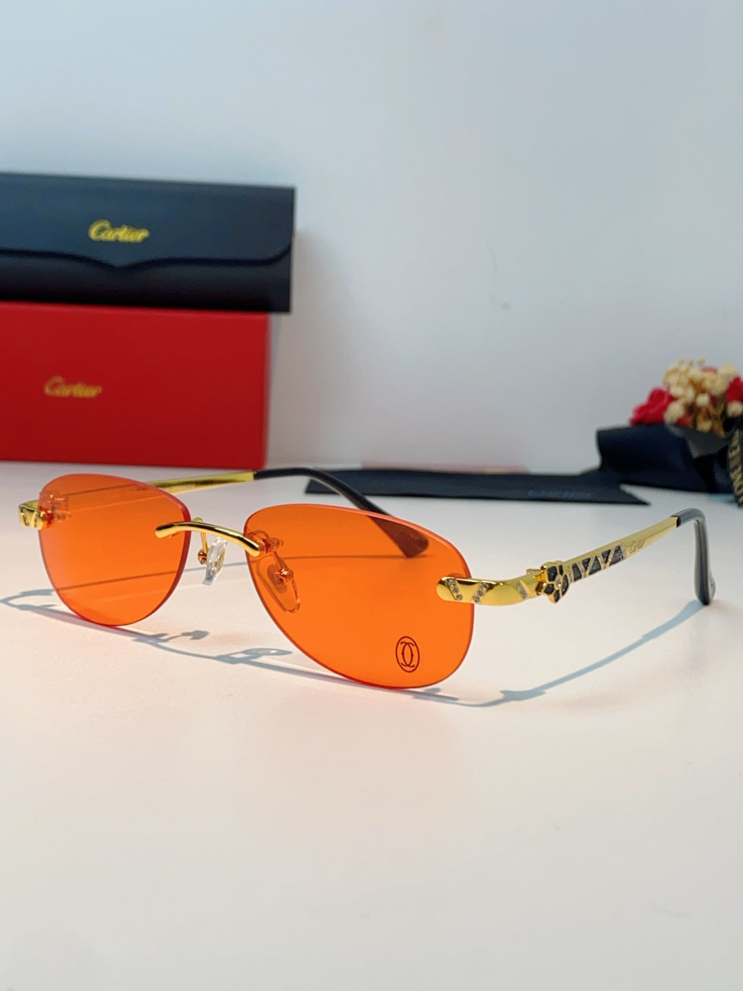 Cartier Lightweight Rimless Orange Lens Sunglasses for Men & Women