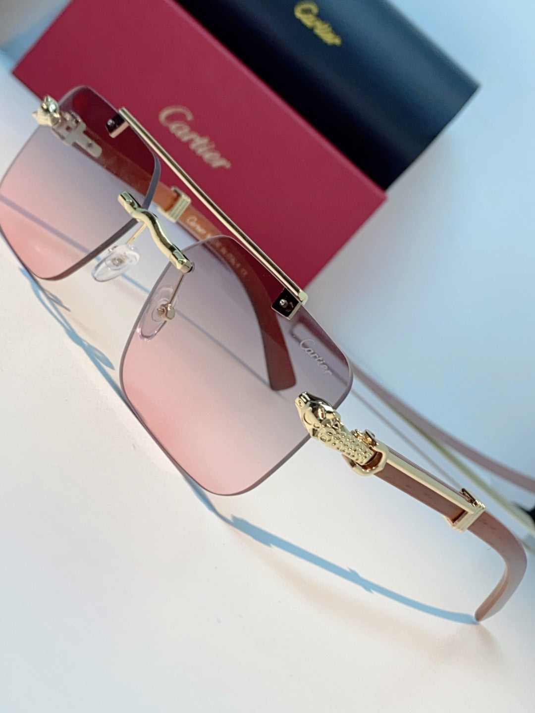 Cartier Lightweight Rimless Red Lens Sunglasses for Men & Women - detail image 7
