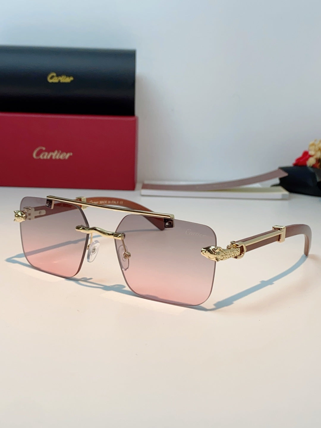 Cartier Lightweight Rimless Red Lens Sunglasses for Men & Women