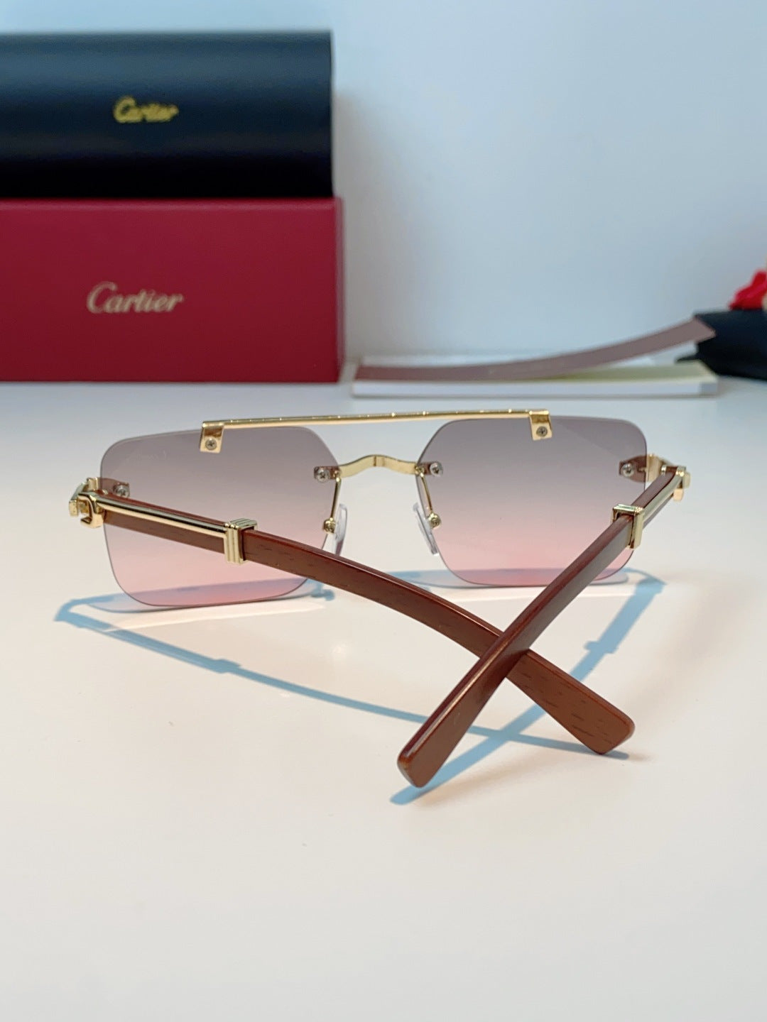 Cartier Lightweight Rimless Red Lens Sunglasses for Men & Women - detail image 3