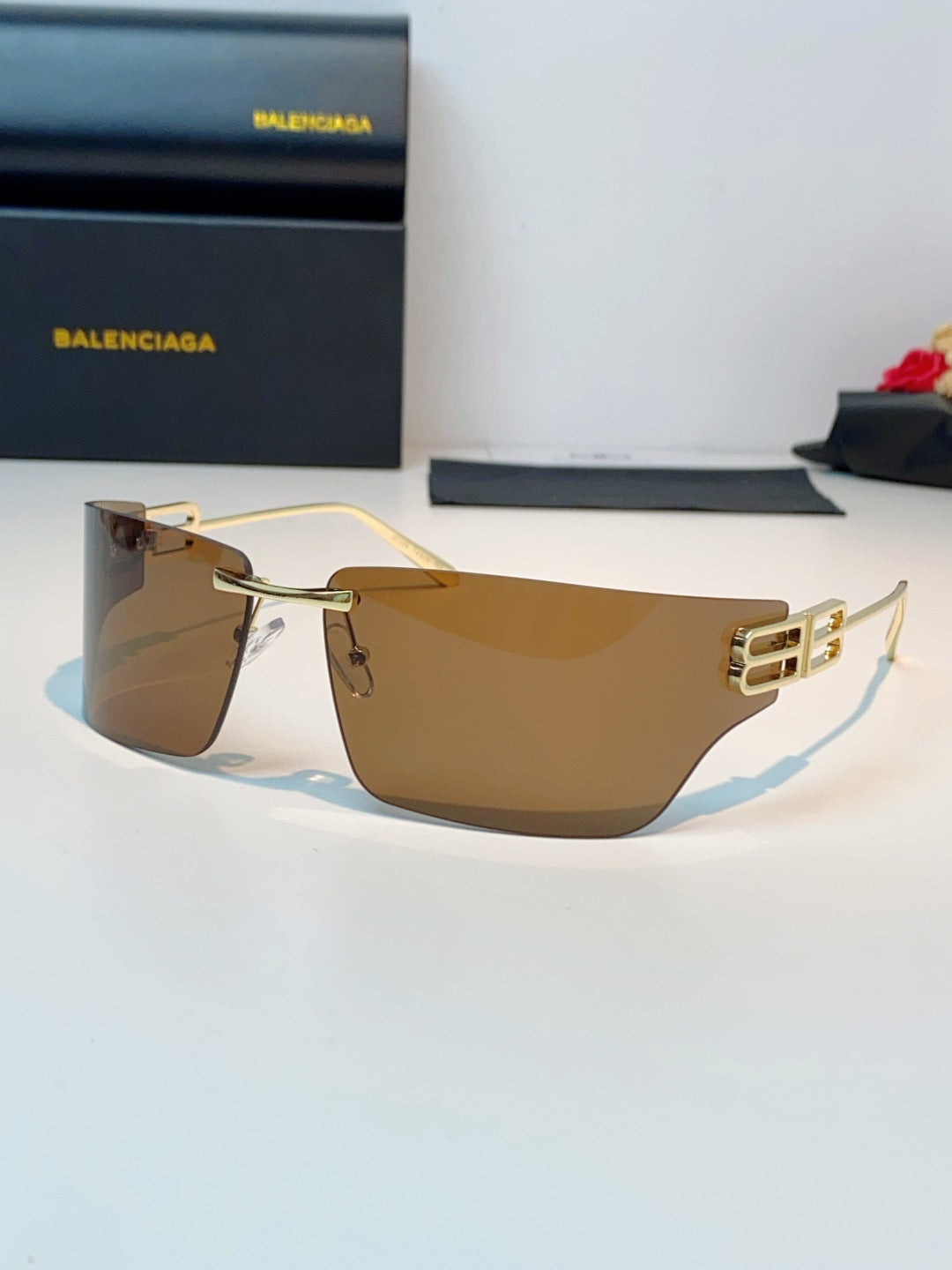 Balenciaga Lightweight Rimless Brown Lens Sunglasses for Men & Women